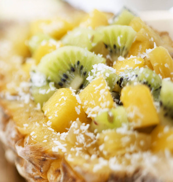 Pineapple with kiwi fruit and grated coconut
